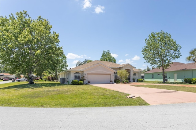 single story home with a garage, central AC, and a front yard