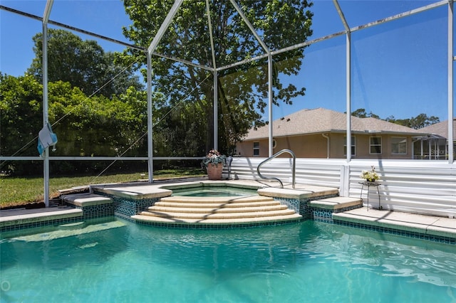 view of swimming pool with a lanai and an in ground hot tub