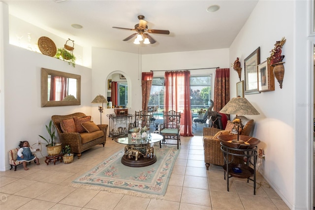 living room featuring ceiling fan and light tile flooring