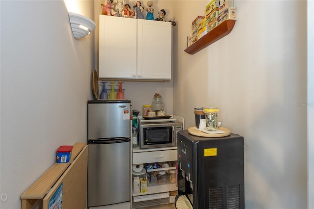 kitchen with stainless steel appliances and white cabinets