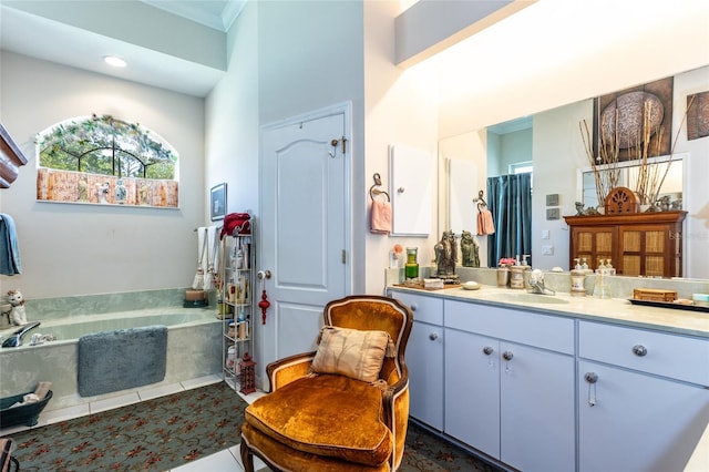 bathroom with tile flooring, vanity with extensive cabinet space, and tiled bath