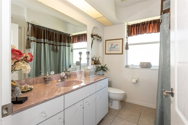 bathroom with toilet, tile floors, and vanity