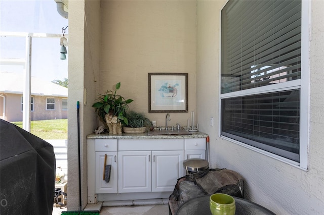 interior space featuring sink and area for grilling