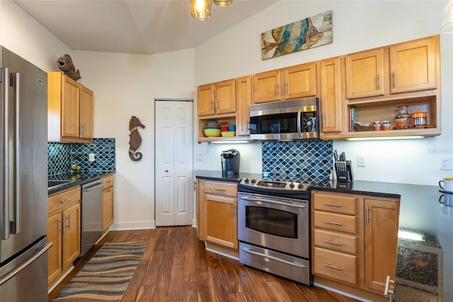 kitchen with dark hardwood / wood-style flooring, backsplash, and stainless steel appliances