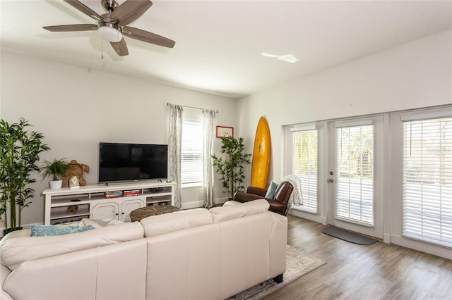 living room featuring hardwood / wood-style flooring and ceiling fan