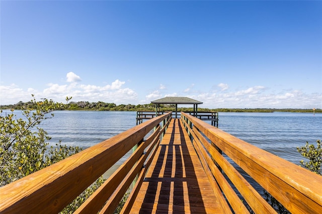 view of dock with a water view and a gazebo