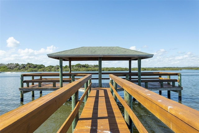 view of dock with a water view and a gazebo