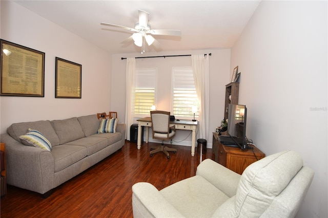 living room featuring ceiling fan and dark hardwood / wood-style floors