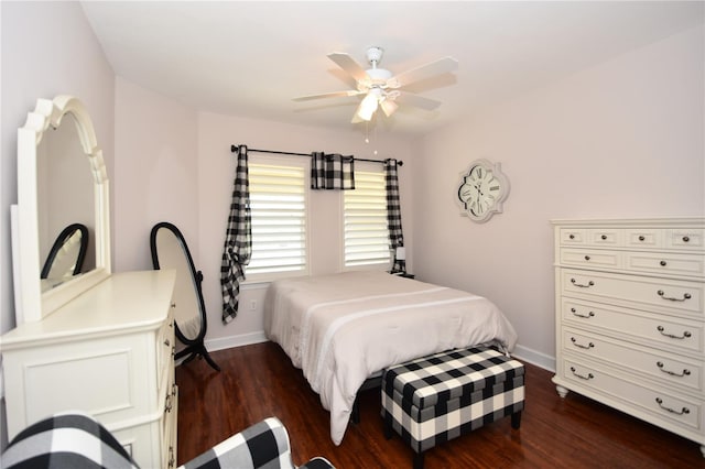 bedroom featuring dark hardwood / wood-style flooring and ceiling fan