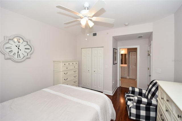 tiled bedroom featuring ensuite bath, ceiling fan, and a closet