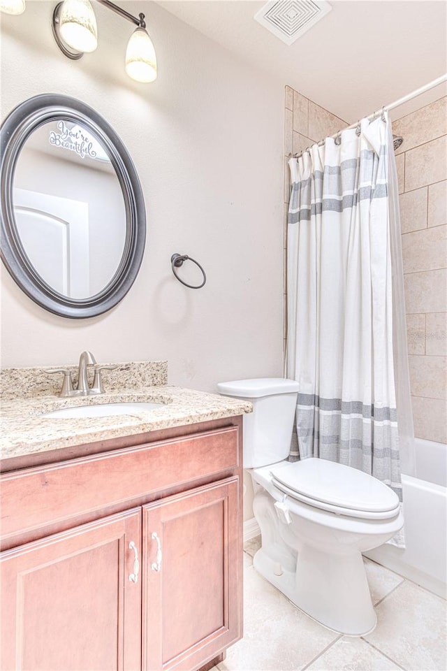 full bathroom featuring toilet, vanity, tile patterned flooring, and shower / tub combo with curtain