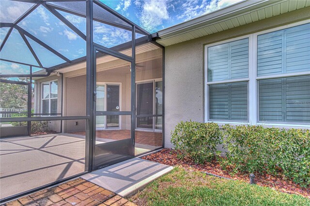 doorway to property with a patio area