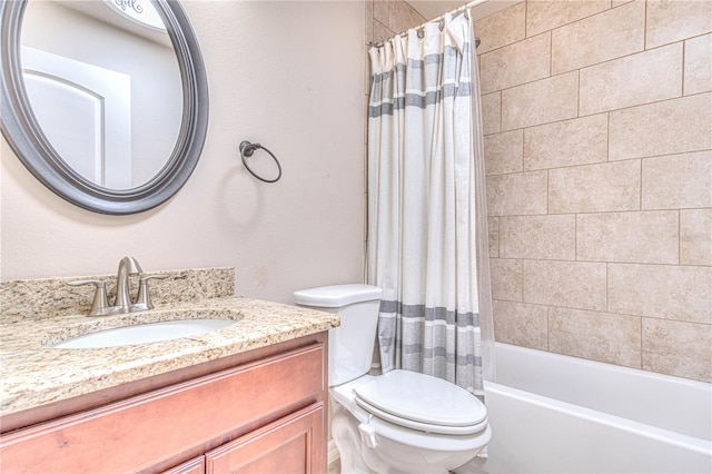 full bathroom featuring vanity, shower / tub combo, and toilet