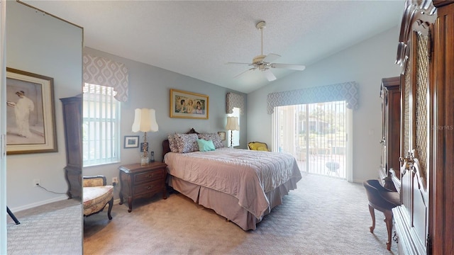 carpeted bedroom with ceiling fan, vaulted ceiling, a textured ceiling, and access to outside