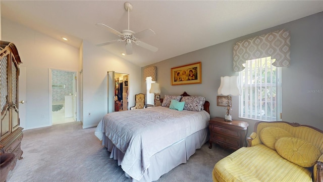 bedroom with ensuite bathroom, a closet, carpet floors, and ceiling fan