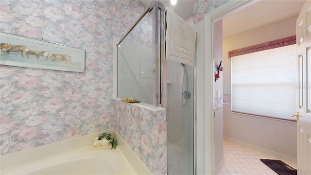 bathroom featuring separate shower and tub and tile floors