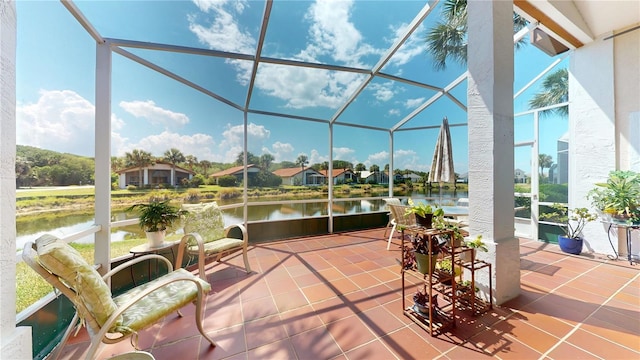 sunroom / solarium with a water view