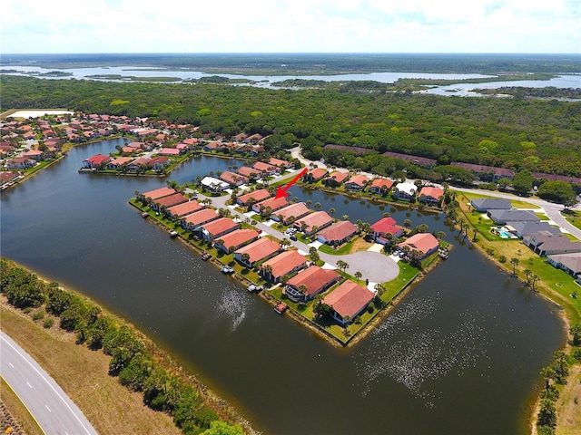 birds eye view of property with a water view