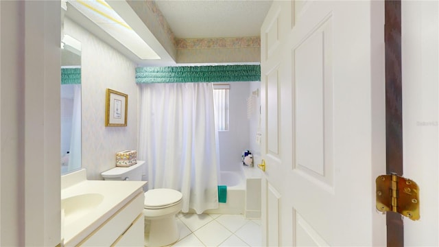 full bathroom with plenty of natural light, shower / tub combo with curtain, tile floors, toilet, and vanity