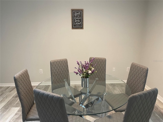 dining room with hardwood / wood-style floors