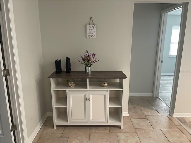 interior space featuring light tile floors