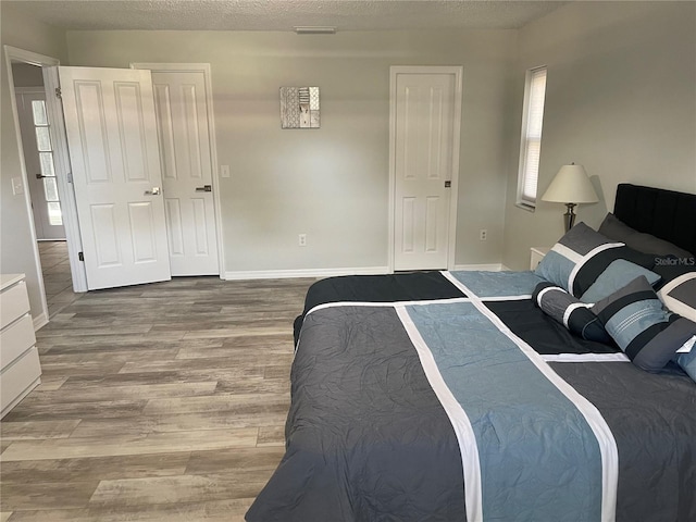 bedroom featuring a closet and hardwood / wood-style floors