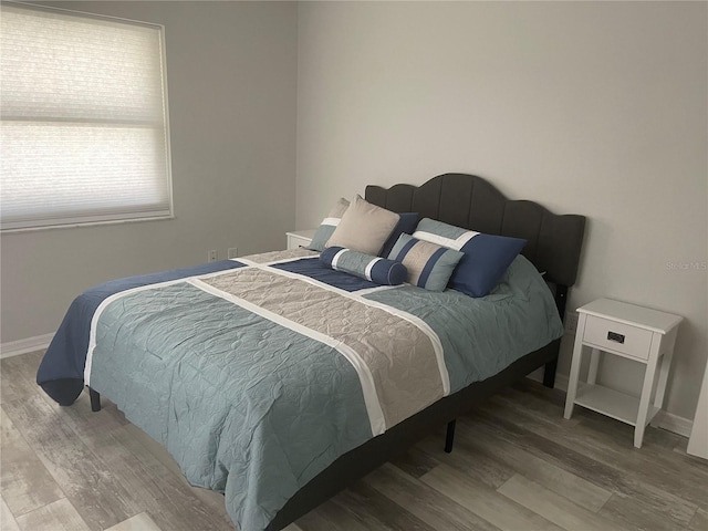 bedroom featuring hardwood / wood-style flooring