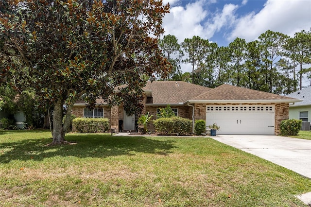 view of front of home with a garage, a front lawn, and central air condition unit