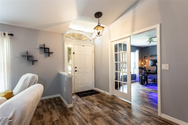 foyer featuring dark hardwood / wood-style floors and french doors