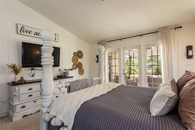 bedroom featuring carpet flooring, vaulted ceiling, and access to outside