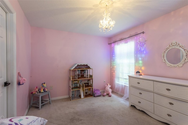 bedroom with an inviting chandelier and light carpet