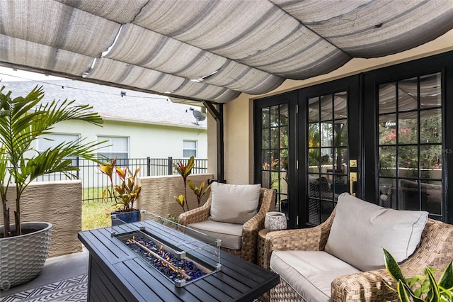 view of patio / terrace featuring french doors, a pergola, and a fire pit