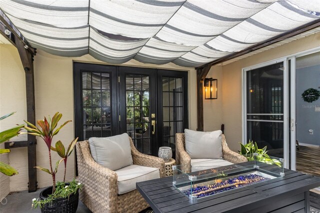 exterior space with french doors and a fire pit