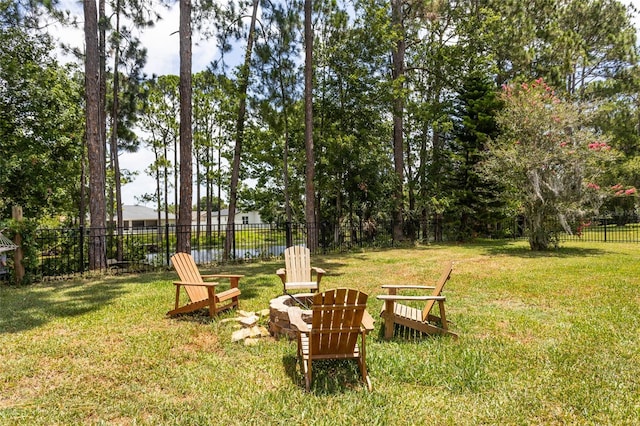 view of yard featuring an outdoor fire pit