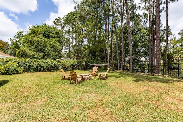 view of yard with an outdoor fire pit