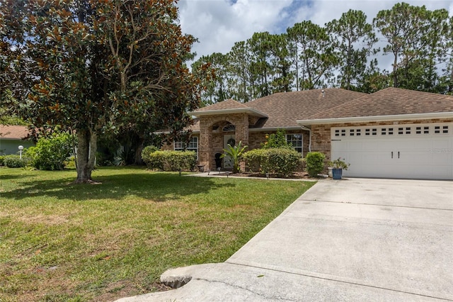 single story home featuring a garage and a front lawn