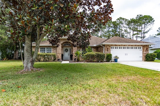 view of front of home featuring a garage and a front lawn