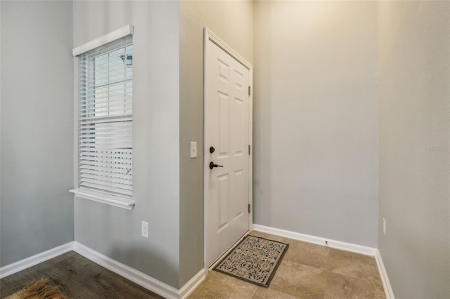 doorway featuring tile floors