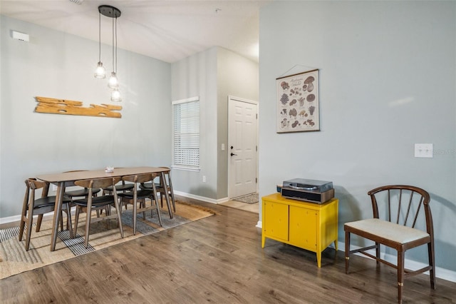 dining room with hardwood / wood-style flooring