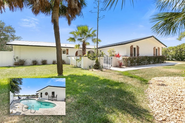 view of yard featuring a fenced in pool and a patio