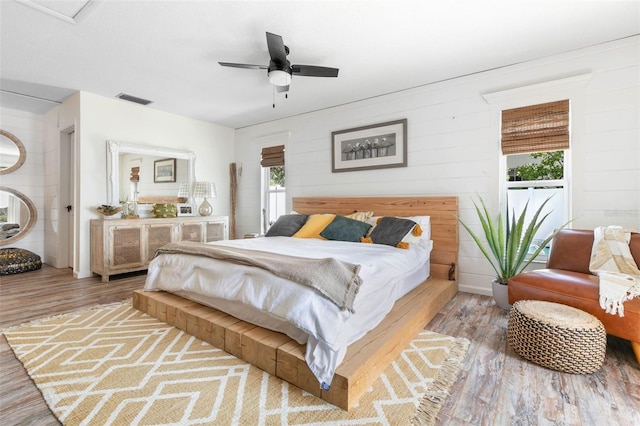 bedroom featuring hardwood / wood-style floors and ceiling fan