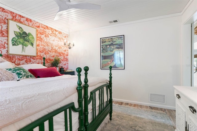 bedroom featuring ceiling fan, hardwood / wood-style flooring, and wood ceiling