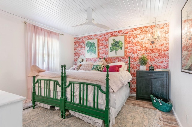 bedroom featuring wood ceiling, ceiling fan, and hardwood / wood-style floors