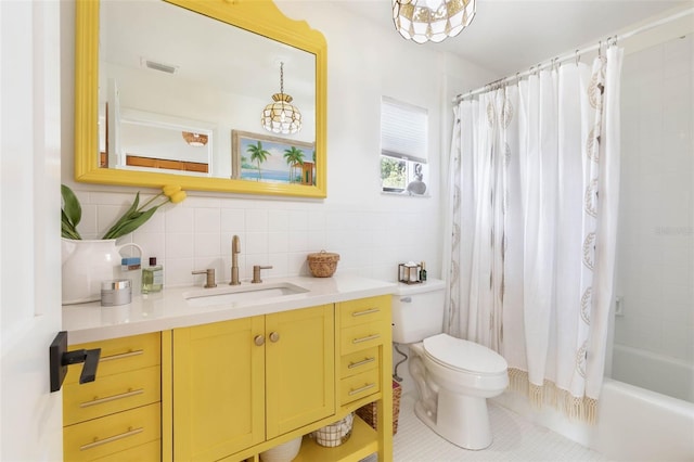 full bathroom with shower / bath combination with curtain, vanity, tile walls, backsplash, and toilet