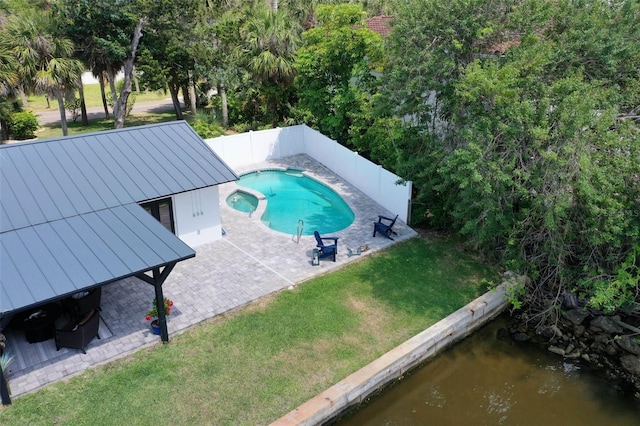 view of swimming pool with a patio area and a yard