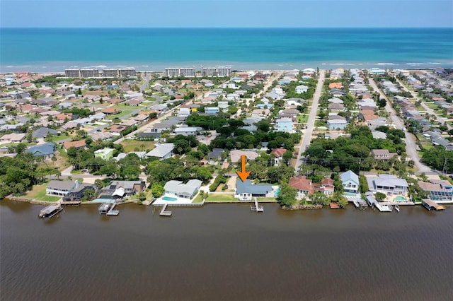 birds eye view of property with a water view