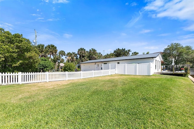 rear view of property featuring a lawn