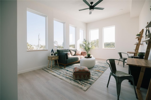 interior space featuring ceiling fan, a healthy amount of sunlight, and light hardwood / wood-style floors