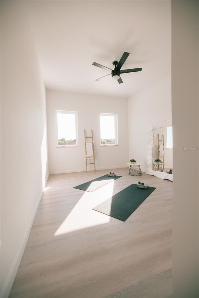 interior space with light hardwood / wood-style flooring and ceiling fan