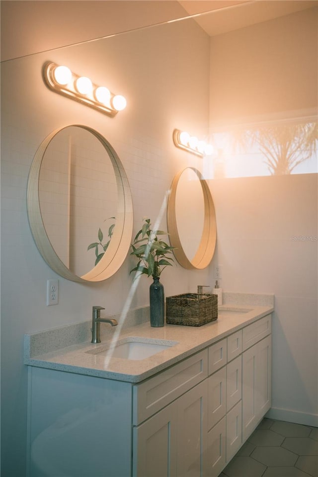 bathroom with tile patterned flooring and vanity